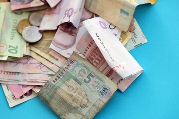 Big amount of different Ukrainian hryvnia money bills. Pile of crumpled ukrainian banknotes