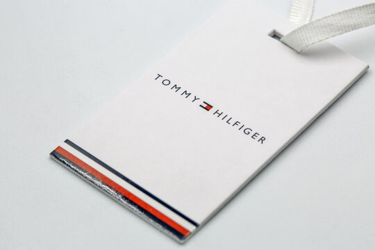 Tommy Hilfiger white shopping bag with brand logo closeup.