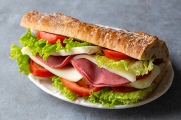 Cold sandwich with cheddar cheese and ham