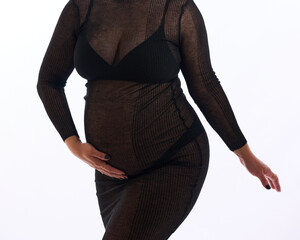 HOUSTON, TEXAS - October 9th 2025: Joyful maternity portraits at The Woodlands studio featuring creative lighting, professional equipment, and an elegant “It’s a boy!” pregnancy reveal.