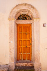 Colorful decorative doors of old houses in the streets of Ayvalik city center. Ayvalik - Turkey