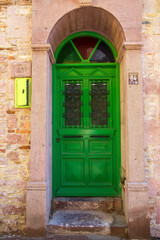 Colorful decorative doors of old houses in the streets of Ayvalik city center. Ayvalik - Turkey