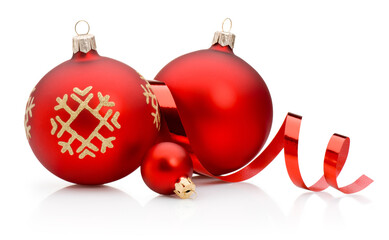 Three red Christmas decoration baubles and curling paper ribbon isolated on white background