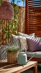 A cozy outdoor seating area with lavender in a basket, a watering can, and decorative pillows against a bamboo and wooden backdrop.