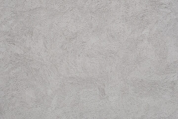 刷毛の模様が美しいコンクリートの壁。灰色でざらざらした質感の背景
