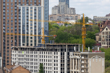Urban High-Rise Construction with Tower Crane and Modern Apartments
