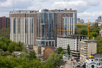 Urban High-Rise Construction with Tower Crane and Modern Apartments