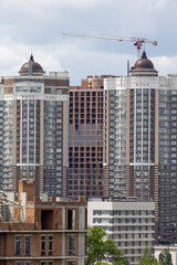 Urban High-Rise Construction with Tower Crane and Modern Apartments