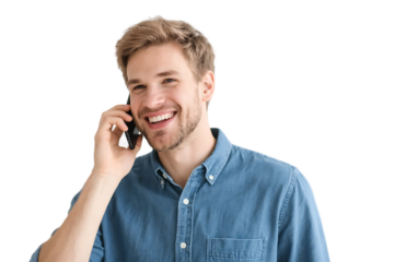 A man in a blue shirt is engaged in a phone conversation, showing a cheerful expression.