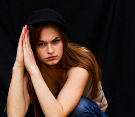 Young Woman Pondering Deep Thought in Studio Shot