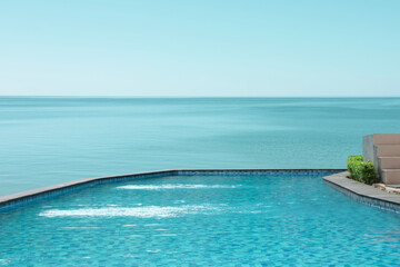Swimming pool with clear water and infinity view on ocean