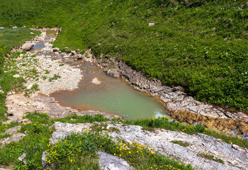 canyon of a mountain river, the structure of rocks coming to the surface, walks along the rocky...