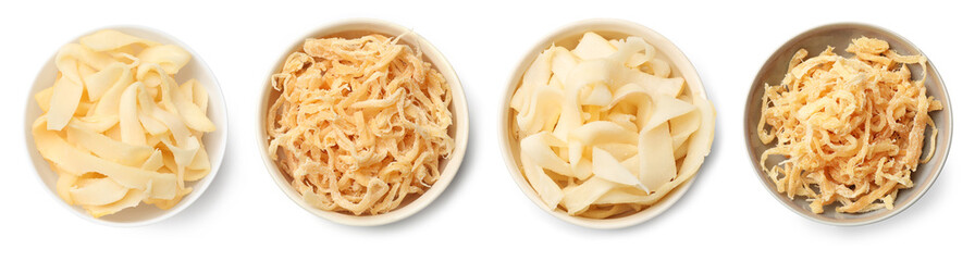 Dried squid. Tasty snacks on white background, top view