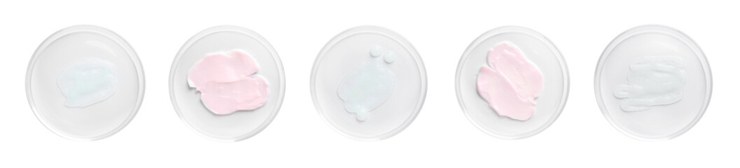 Petri dishes with cosmetic products on white background, top view