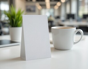 A vertical business card mockup resting on a clean white desk with a blurred office background, featuring a blank surface for logos or text and a coffee cup. Generative AI