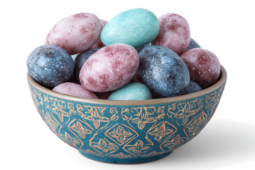 Colorful pastel chocolate Easter eggs in a decorative bowl a festive treat for spring celebrations isolated on white