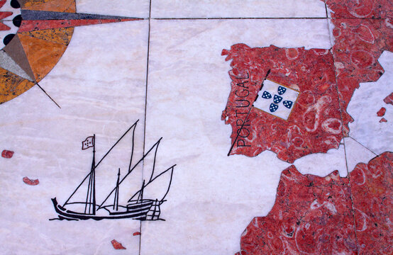 Portugal, Lisbon, Belem. Detail of huge wind rose laid in marble depicting the Portuguese discovery expeditions. Caravel - caravela arriving at the Azores Islands on its way to Brazil.