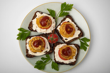 Mini sandwiches with skewers on a plate