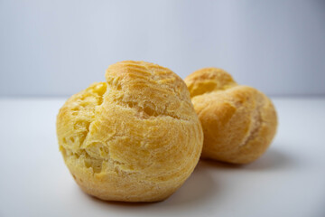 French cream puffs without filling isolated on a white background. Profiteroles