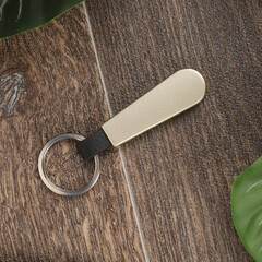 Sleek Metal Keychain With Gold Tag And Black Strap