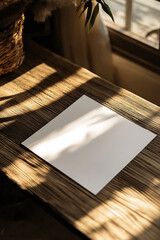 An A4 paper mockup placed on a rustic wooden table with a clean blank surface, ideal for logo or text placement, lit by soft natural light. Generative AI