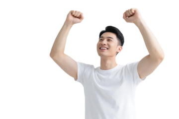 A young man in a white t-shirt raises his fists, displaying a sense of achievement and positive energy.