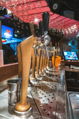 Tavern in Brussels, view of the bar where you can see the taps that supply beer to visitors.