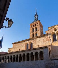 The Romanesque-Mudéjar brick tower and arched portico of the Church of San Martín are bathed in...