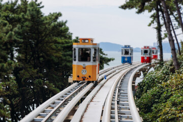Fototapeta premium Haeundae Blue Line Park, Busan, ride on multicoloured sky capsule train, railway tram route from Mipo to Cheongsapo station, coastal monorail in Busan, Yeongnam, South Korea, Republic of Korea travel