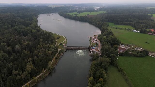 Aerial of Landsberg am Lech. Lechstaustufe 15 under repair with ecological fish ladders and river restoration. Riverside and forests from above. Renovierung mit Fischtreppen und Flussrenaturierung