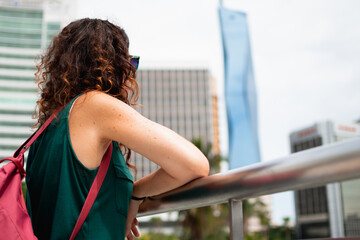 Woman tourist sightseeing city skyline urban travel
