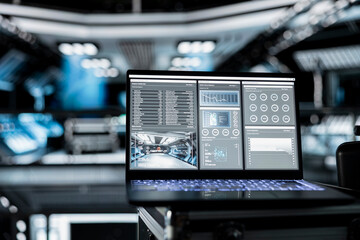 Laptop in space shuttle showing diagnostics tracking thermal stability and core performance during orbital flight. Notebook display presenting key spaceship engine readouts statistics