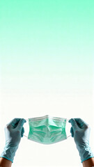 Gloved Hands Hold a Fresh Green Medical Mask Against a Bright Gradient Background