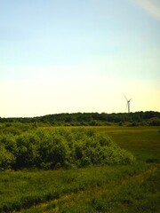 Fototapeta premium Renewable energy wind turbine in rural countryside