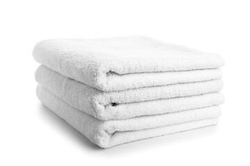 Stack of clean towels isolated on white background, closeup