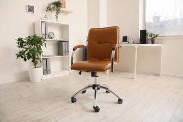 Office leather brown chair in interior of room, closeup