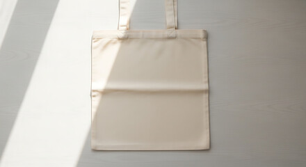 Blank tote bag isolated on light surface, eco-friendly fashion concept