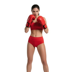 A young woman in red boxing gloves and sportswear is in a fighting stance, showcasing athleticism and readiness for boxing.