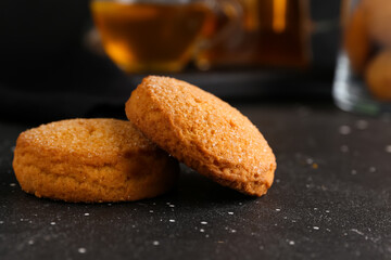 Tasty cookies on black background, closeup