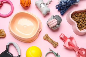 Composition with bowls and pet accessories on yellow background, closeup