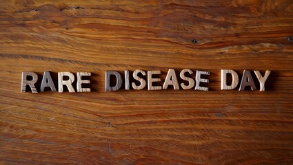 Rare Disease Day Wooden Letters on Textured Wood Background Concept