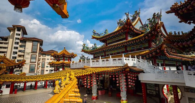 Kuala Lumpur, Malaysia &ndash; October 13, 2025: Time lapse of Thean Hou Temple courtyard decorated with hundreds of lanterns, visitors walking and clouds moving above
