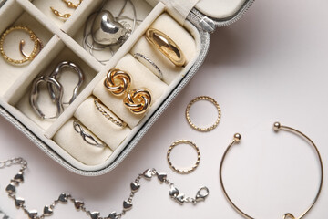 Organizer with different stylish jewelry on white background, closeup