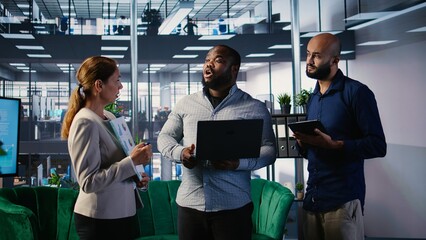 Diverse business leaders sharing their expertise for a new collaboration opportunity, discussing...