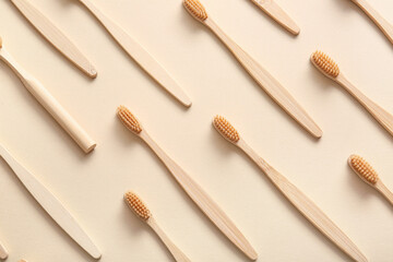Composition with wooden toothbrushes on beige background, closeup