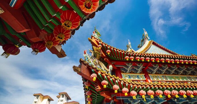 Kuala Lumpur, Malaysia &ndash; October 13, 2025: Time lapse of Thean Hou Temple courtyard decorated with hundreds of lanterns, visitors walking and clouds moving above