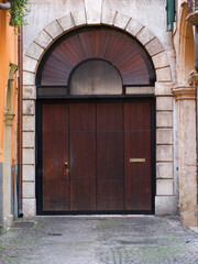 Large Wooden Door Stone Archway Cobblestone Street Narrow Historic Street