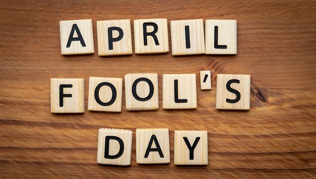 April fools day spelled out with scrabble tiles on wood