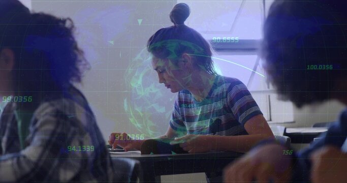 Writing male teenager wearing striped shirt leaning over notebook in classroom, with data overlay