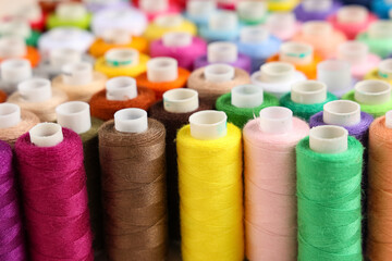 Many different thread spools as background